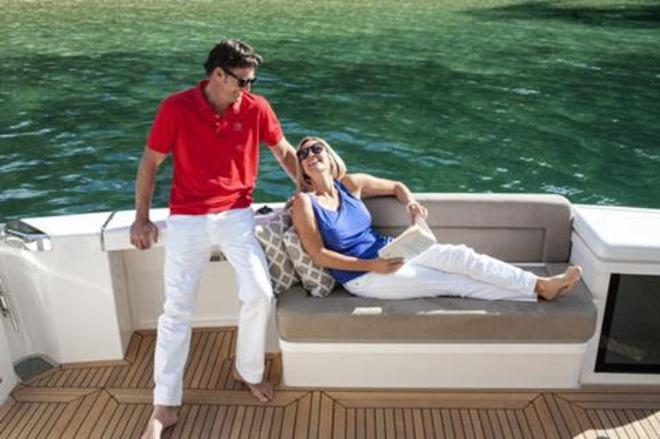 The 575's innovative cockpit layout creates an entirely new indoor/outdoor experience, including transom seat and storage, wet bar with twin BBQ, fridge and ice-maker. © Riviera Australia